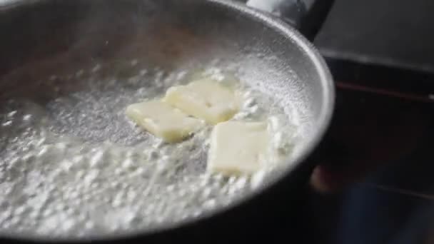 Melting butter is tossed in a pan