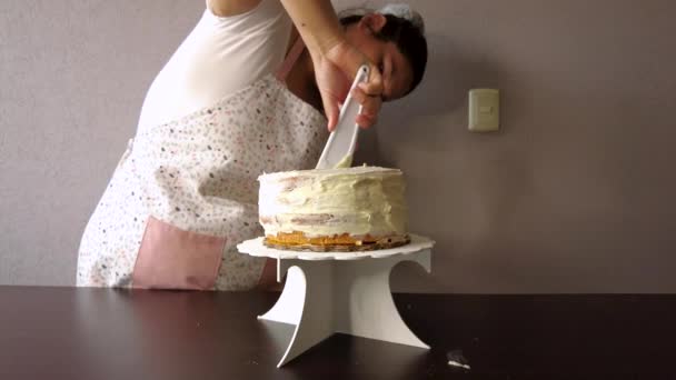 Latin Woman Wearing Apron Preparing Cooking Baking Cake Spreading Butter — Stock Video
