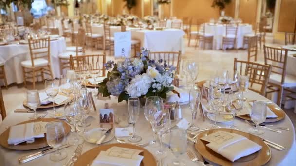 Elegant Gold Tableware Place Setting On Round Table In Wedding Venue.
