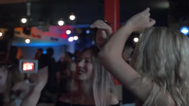 a group of women dancing in a club