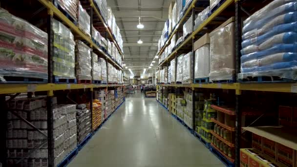 Wholesale Warehouse Aisle Stacked Shelves Ceiling Slow Pedestal — Stock Video