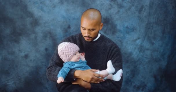 Family takes portrait with crying baby.