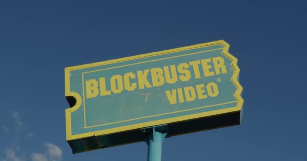 Wide Shot Old Blockbuster Video Sign — Stock Video