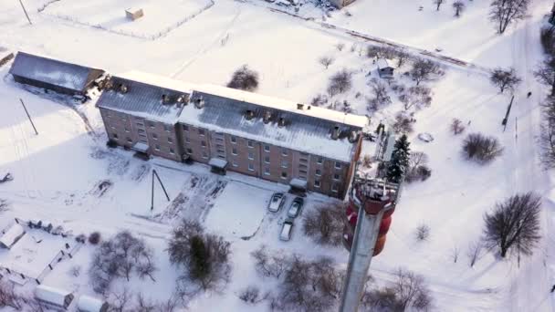 Small Apartment Building Tall Tele Communication Tower Winter Season Aerial — Stock Video