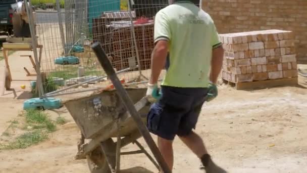 Construction Bricklayer Wheels Barrow Full Mortar Job Site — Stock Video