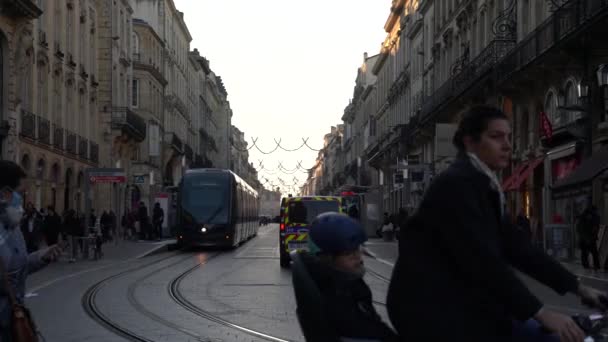 Tramway Cars Move Tracks Both Directions While People Vehicles Pass — Stock Video