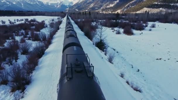 Train Valley Followed Winter Snow Oil Tanks Flyover — Stock Video