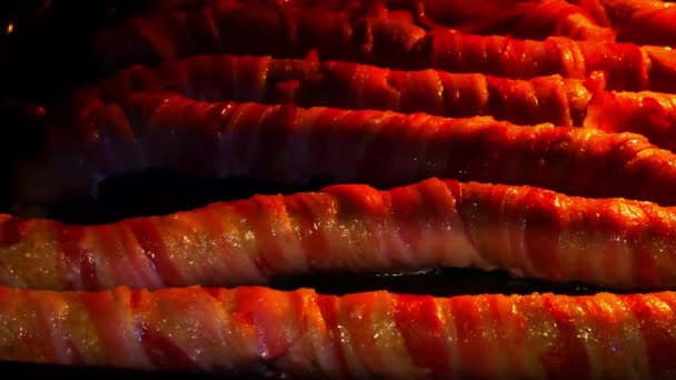 Opening Oven Reveal Sizzling Extra Long Pigs Blankets Bacon Wrapped — Stock Video