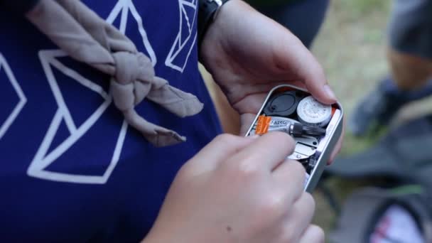 Scout Holding Opening Small First Aid Kit Outdoor Survival Kit — Stock Video