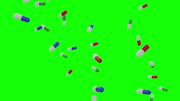 医学の概念 アルファマットと緑の画面に落ちる多色カプセル — ストック動画