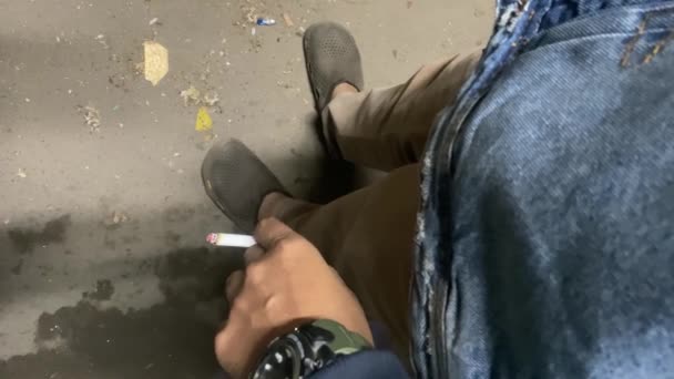 Male Hand Holding Lit Cigarette Smoke Rising Top View Close — Stock Video