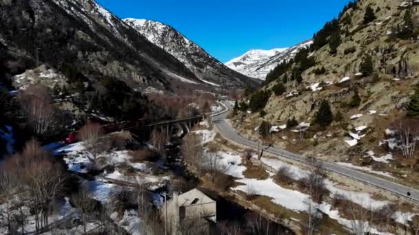 Aerial Red Train Crossing River Stone Bridge Pyrenees Heading Snowy — Stock Video