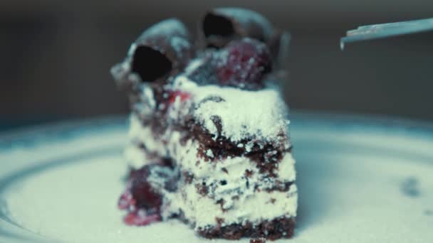 Removing Cherry Sweet Chocolate Cream Cake Rotating Plate — Stock Video