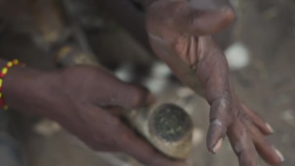 Cinematic Close Shot Tribal African Man Smoking Cannabis Pipe Preparing — Stock Video