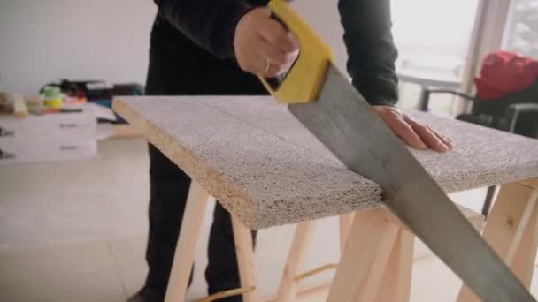 Medium Shot Male Handyman Using Handsaw Cut Acoustic Panel Ceiling — Stock video