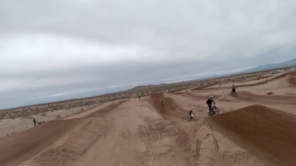 Motorcycles Taking High Jumps Fly Racetrack Mojave Desert Leading Aerial — Stock Video