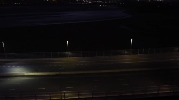Illuminated Aerial View Vehicles Driving Highway Traffic Lanes Night Pan — Stock Video