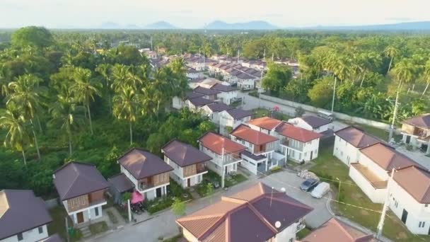 Dolly Out Aerial Shot Newly Built Village Asia Mountain Background — 비디오