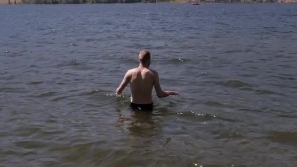 Slow Motion Man Wading Out Lake Going Swimming — Stok Video