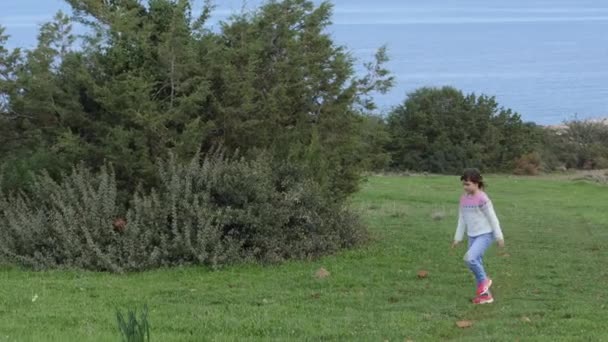 Little Girl Exploring Nature Bends Pick Something — Stock Video