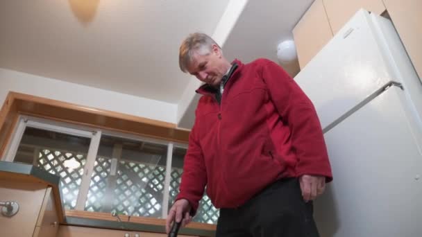 House Inspector Examines Floor Covering Possible Asbestos Containg Material — Stock Video
