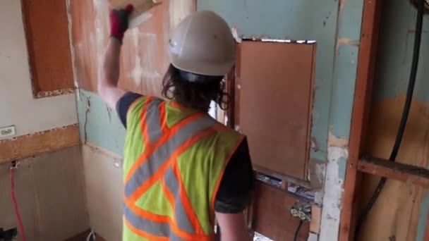 Worker Demolishes Plaster Wall — Stock Video