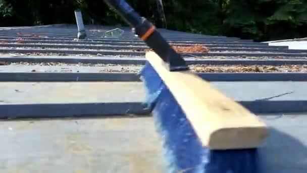 Guy Sweeping Roof — Stock Video