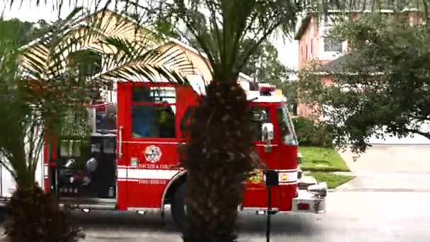 Red Firetruck Passing Trough Street — Stock Video