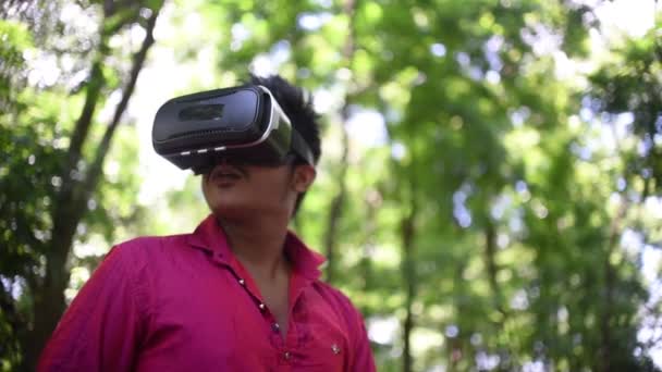 South Asian Indian Boy Using Enjoying Virtual Reality Headset Experience — Stock Video