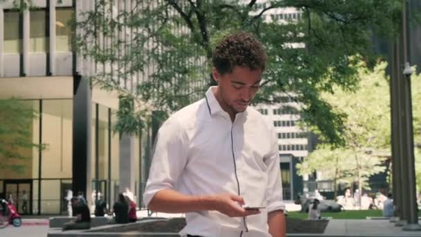 Attractive Mixed Race Professional Looks His Phone Checks Emails Courtyard — Stock Video