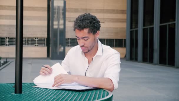 Young Attractive Mixed Race Professional Takes Document Out Folder Table — Stock Video