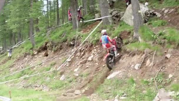 Slow Motion Moto Trial Dirt Bike Rider Makes Large Climb — Stock video