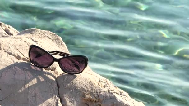 Sunglasses Left Stone Beach Focus Glasses — Stock Video