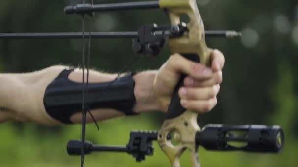Close up of a professional bow being aimed and shot by an archer.