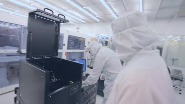 Scientists Working In A Nanofabrication Cleanroom Facility