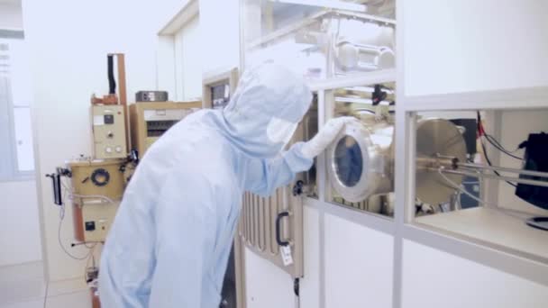 Scientists Working In A Semiconductor Cleanroom Facility