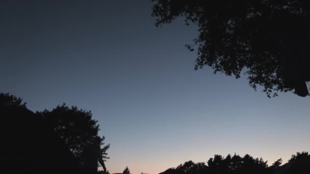 Time Lapse Sunset Set Clear Sky Silhouettes People Moving Foreground — Stock Video
