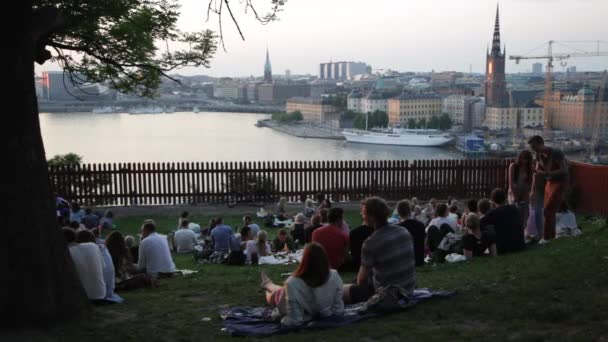 People Enjoy Themselves In A Social Setting Near Stockholms Beautiful Waterways