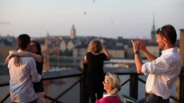 People Enjoy Themselves In A Social Setting Near Stockholms Beautiful Waterways