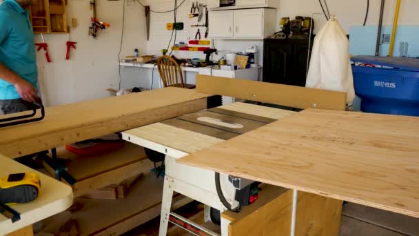 Two Men Rip Cut Half Sheet Plywood Table Saw — Stock Video