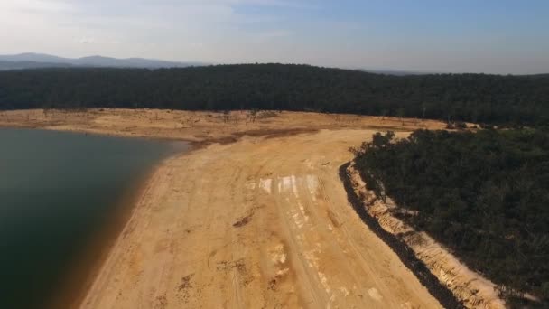 Drone aerial view over dried river bed of Lake Glenmaggie, day time sunny. Wide shot