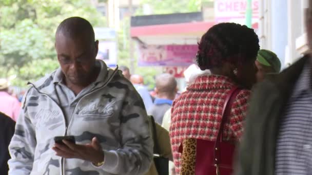 Kenyan Man Using Mobile Device Street Kenya — стокове відео