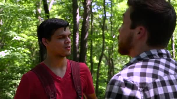 Shoulder Shot Two Young Adult Guys Having Conversation Forest — Stock Video
