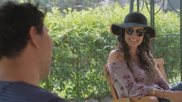 Pretty Hispanic Woman Sunglasses Stylish Hat Flirting Laughing Man Outdoors — Stock Video