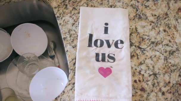 Camera Pans Lowers Dish Towel Says Love Heart Dirty Dishes — Stock Video