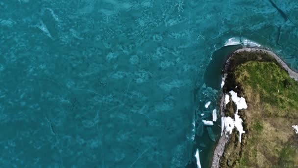 Aerial Top Shot Cracked Frozen Lake Melted Ice Spring Swiss — Stock Video