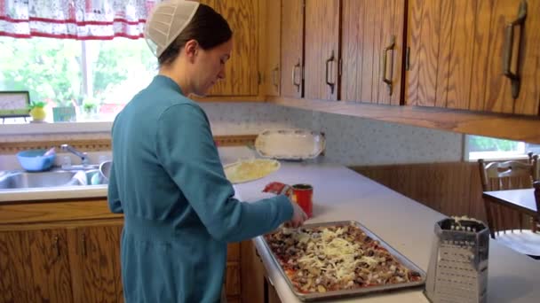 Mennonite Woman Adds Cheese Homemade Dish Slow Motion — Stock Video