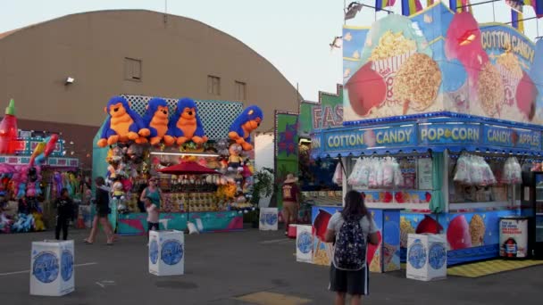 Boy Runs Games Concession Stands Fair — Stock Video