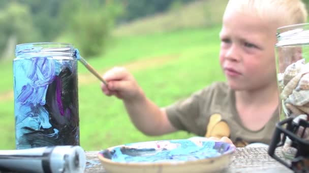 Boy Painting Glass Jar Brush — Stock Video