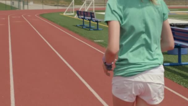 Young Teen Girl Finishes Her Run Track Turns Camera Gives — Stock Video